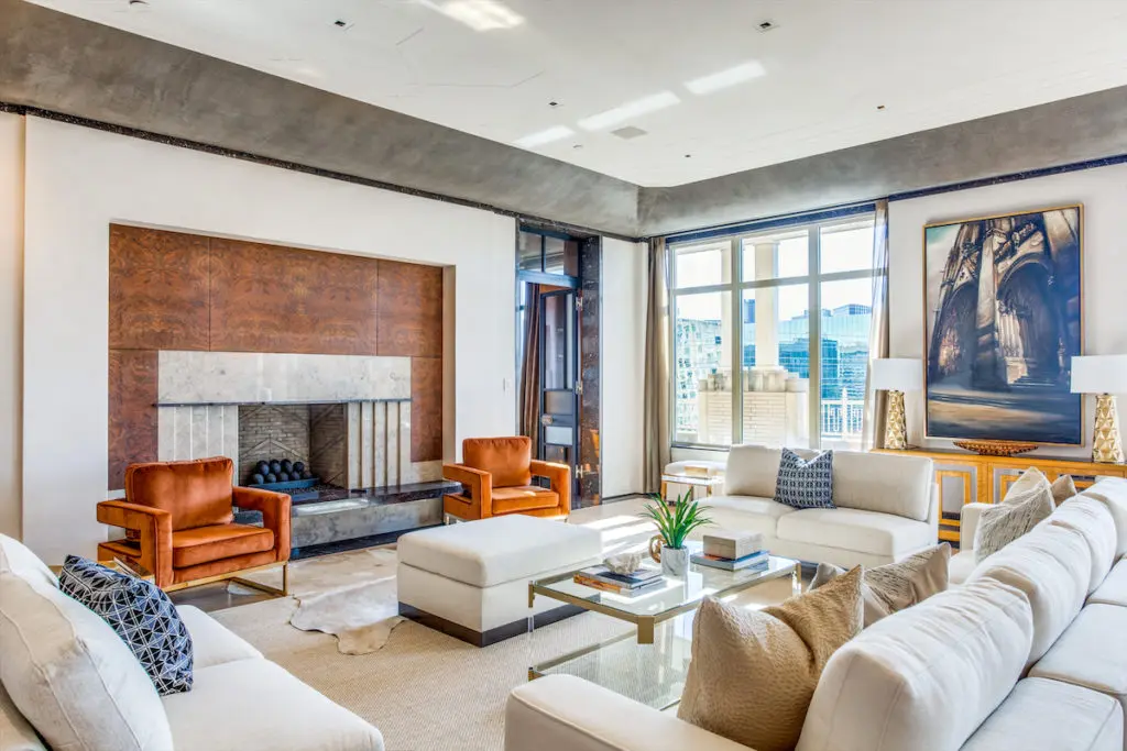 Even in a room filled with stunning elements, the elegant fireplace demands focus. (Photo by Shoot2Sell for Douglas Elliman)