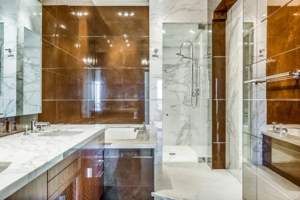 One of four full baths in the Uptown Dallas penthouse. (Photo by Shoot2Sell for Douglas Elliman)