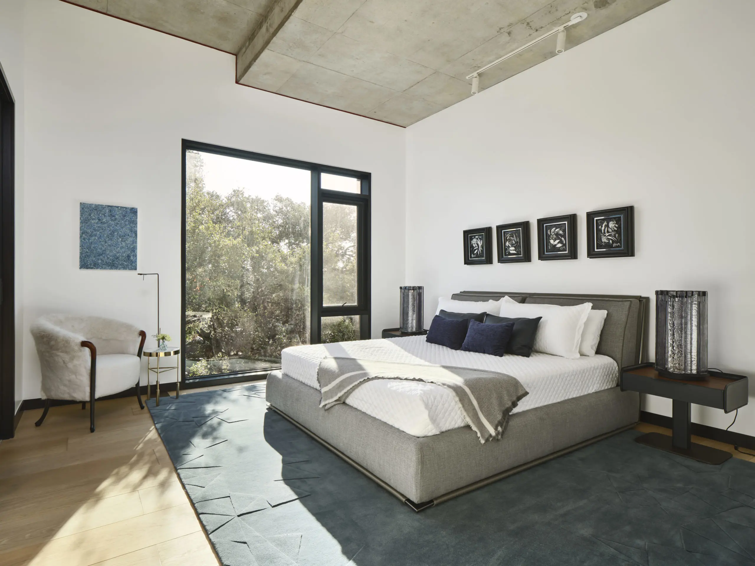 Giorgetti Bed, nightstands, table lamps, area rug and armchair.  MisuraEmme sidetable, Viabizzuno floorlamp, JD Miller "Onyx Dreams I,II", "Night Bloom I,II" and John David Robbins "Ocean Drips 1" artworks.