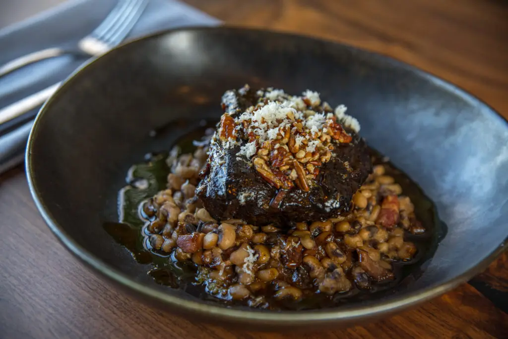 Back Table's hearty six-hour braised chuck short ribs with black eyed peas, a pecan gremolata and fresh horseradish. (Photo by Photos Care of Back Table Kitchen & Bar)