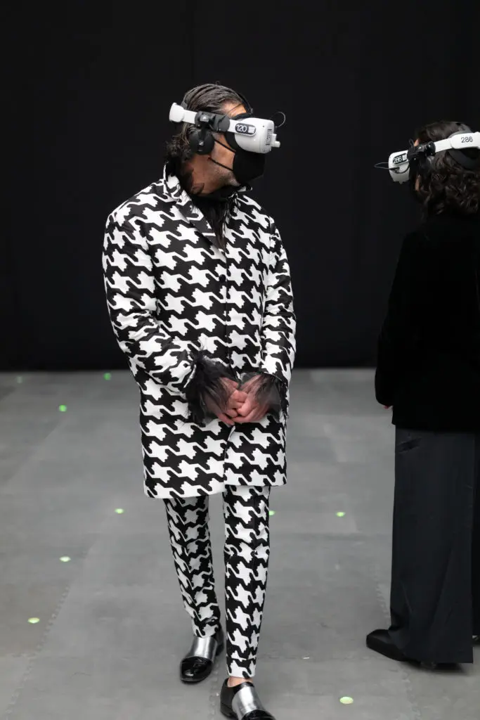 A high-style Ceron dressed to impress while donning the Oculus headset that virtually transports one to the International Space Station.