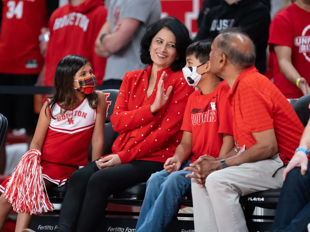 UH president Renu Khator and her family enjoy UH basketball  (Photo by F. Carter Smith)