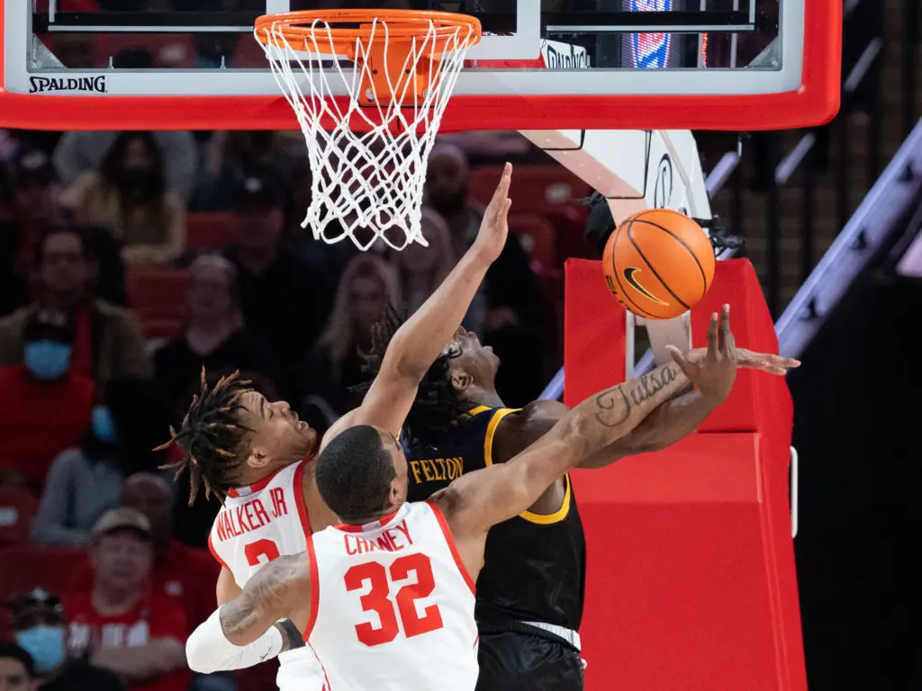 This University of Houston team knows it's all about the defense. Ramon Walker and Reggie Chaney are all in. (Photo by F. Carter Smith)