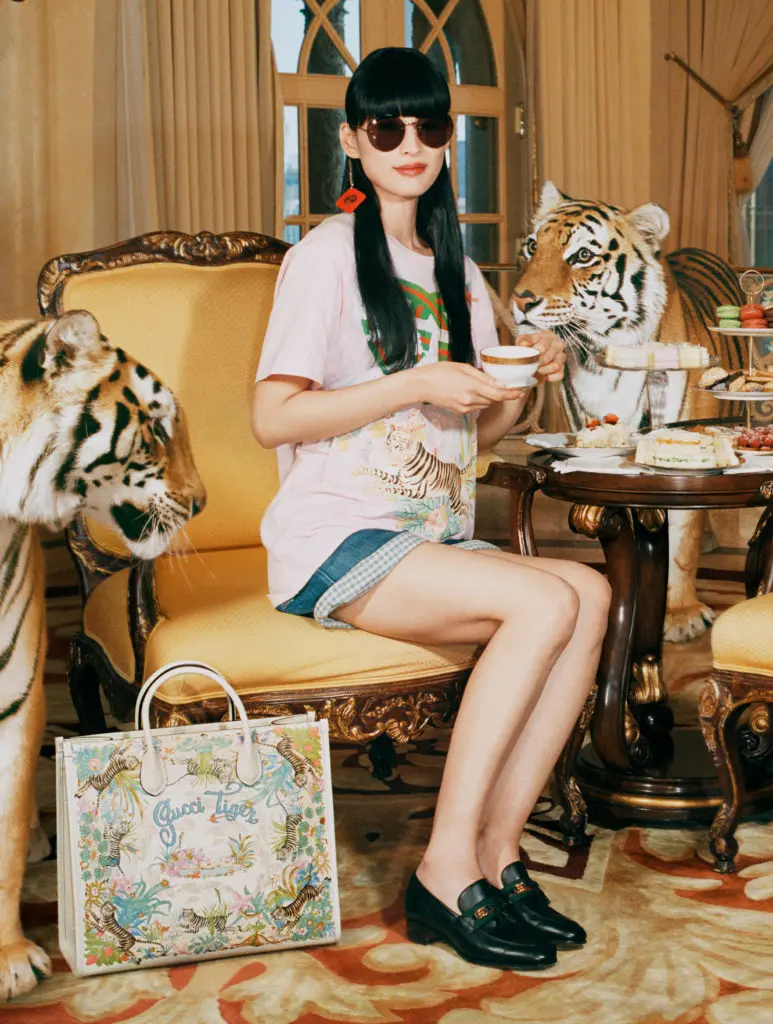 Gucci salutes the Year of the Tiger with a complete ready-to-wear and accessories collection embellished with the tiger image or 'Gucci Tiger' labeling.