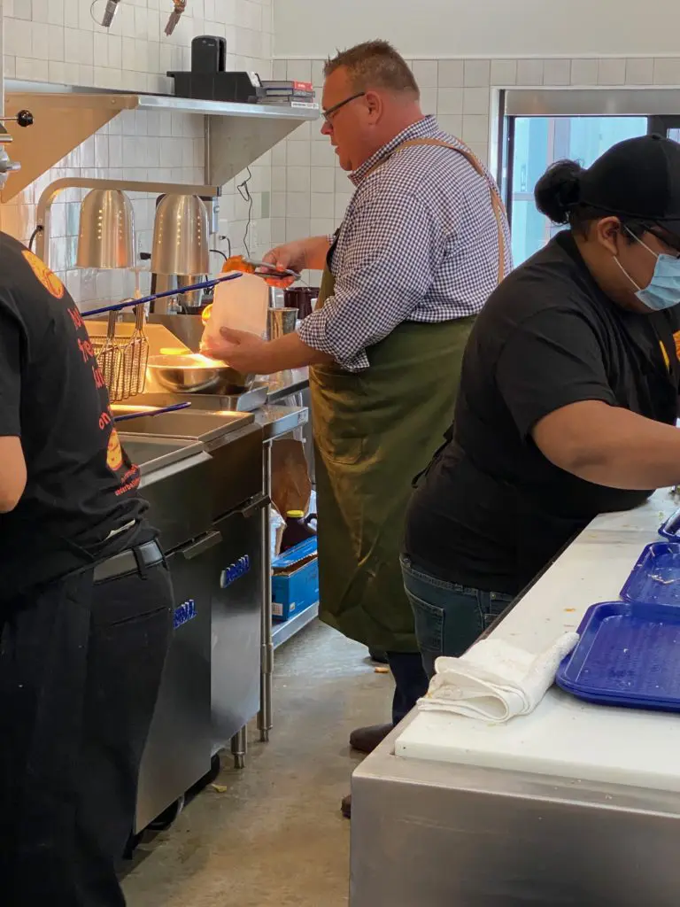 Underbelly Hospitality owner chef Chris Shepherd working the line at his spanking new Underbelly Burger in Houston Farmers Market. (Photo by Shelby Hodge)