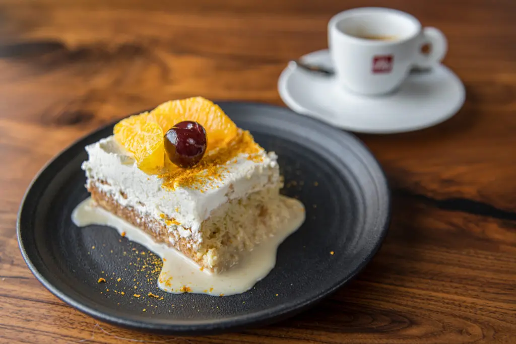 The best dessert on the menu is the bourbon scented tres leches topped with orange slices and a dusting of pulverized dried orange peel.  (Photo by Photos Care of Back Table Kitchen & Bar)