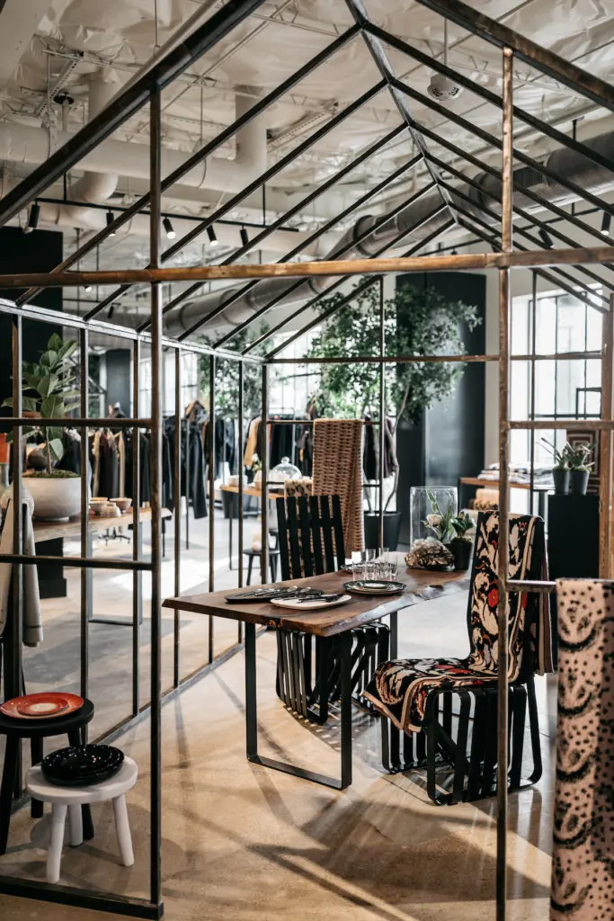 In the greenhouse Living Area, Saved cashmere, dishes by Ann Demeulemeester, Georg Jensen, Tina Frey, vintage Frank Gehry chairs.
(Photo by Rebecca Patton for Beckley)