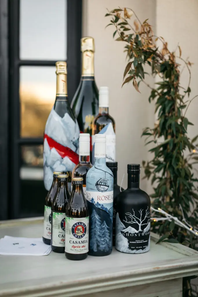 Bottles of Ghostwood Whiskey and Dallas-based Rose Gold Rosé hand-painted by Marisa Renfro. (Photo by Rebecca Patton of Beckley)