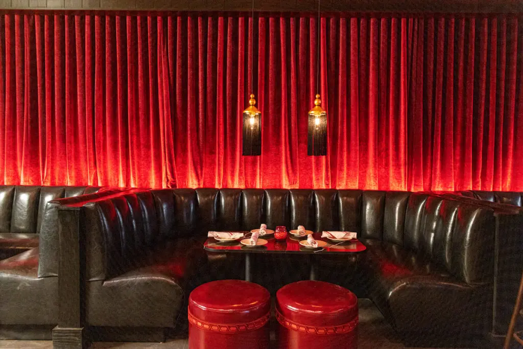Formerly Capitol Pub, the new Sfuzzi space features the same kinds of tables and booths from the original spot on McKinney Avenue. (Photo by Kathy Tran)