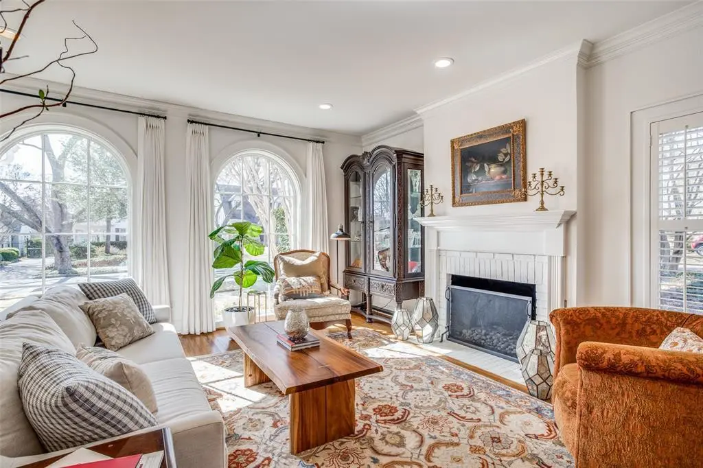 Arched Pella windows flood the front living areas with natural light. 