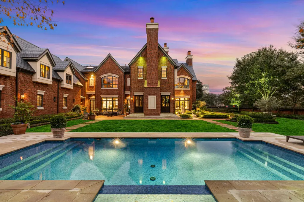The pool centers the vast back lawn of the Frances and Tony Buzbee home at 1722 River Oaks Boulevard.  (Photo by Courtesy of Josh Gremillion for Douglas Elliman)