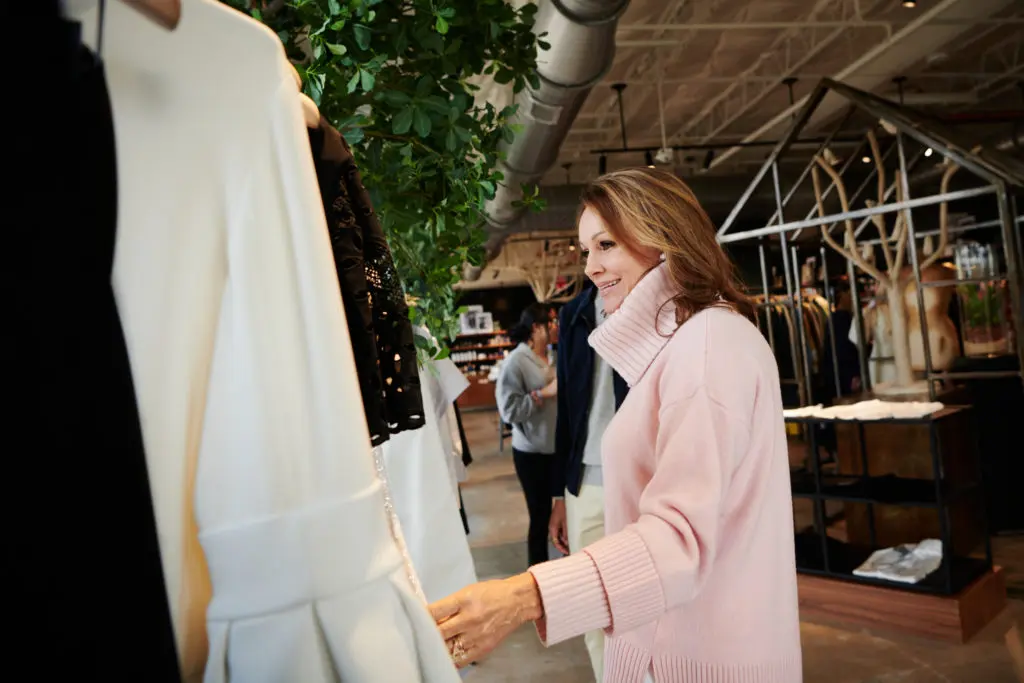 Claire Emanuelson sifting through Adam Lippes' designs (Photo by Jonathan Zizzo)