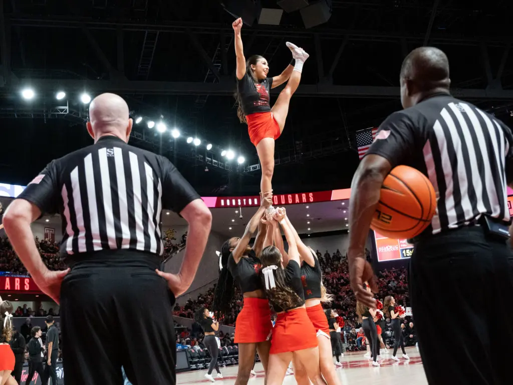 University of Houston cheerleaders add to the Fertitta Center atmosphere. (Photo by F. Carter Smith)