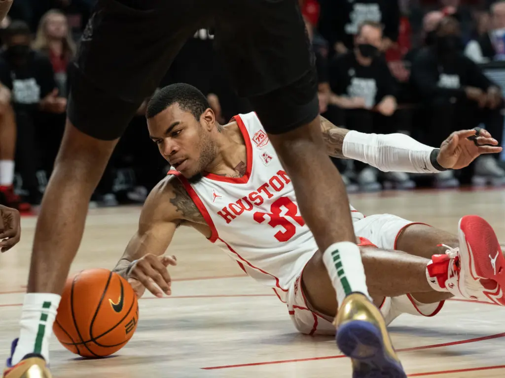 University of Houston forward Reggie Chaney knows you need to be willing to go to the floor to fight for the ball if you want to be accepted by Kelvin Sampson's Houston team. (Photo by F. Carter Smith)