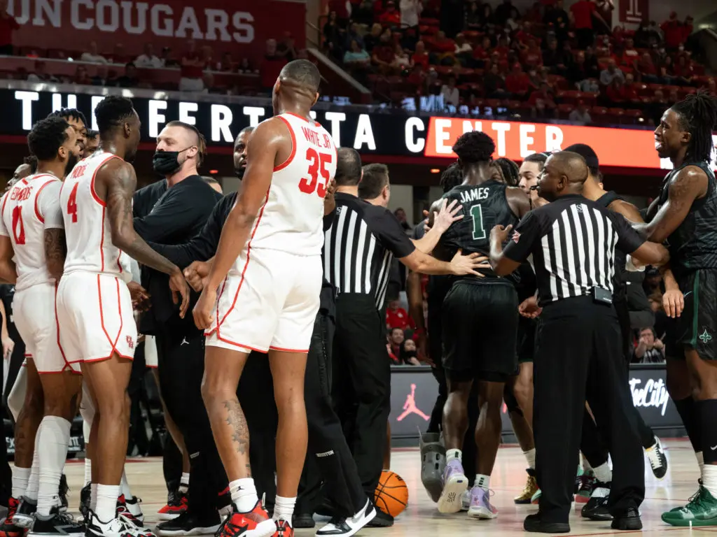 University of Houston players and their Tulane counterparts had to separated at the end of the first half. (Photo by F. Carter Smith)