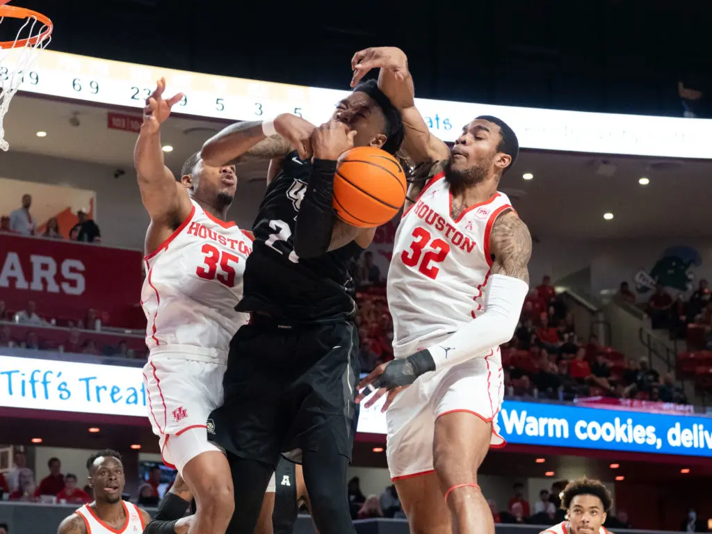 The University of Houston plays a physical defensive style under Coach Kelvin Sampson. Fabian White Jr. and Reggie Chaney know to bring it. (Photo by F. Carter Smith)