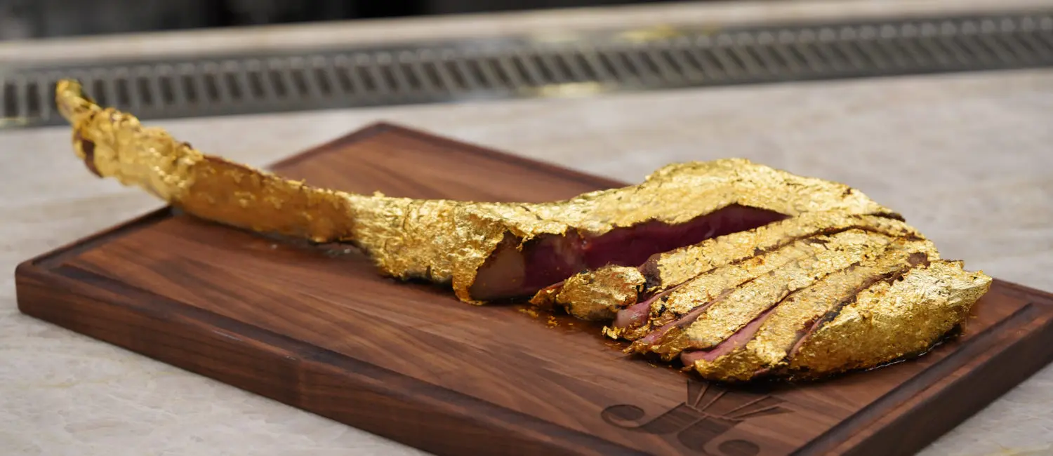 The 34-ounce USDA Prime gold tomahawk ribeye wrapped in 24k gold leaf is highlight of the menu at Juliet. (Photo by In-House Social)