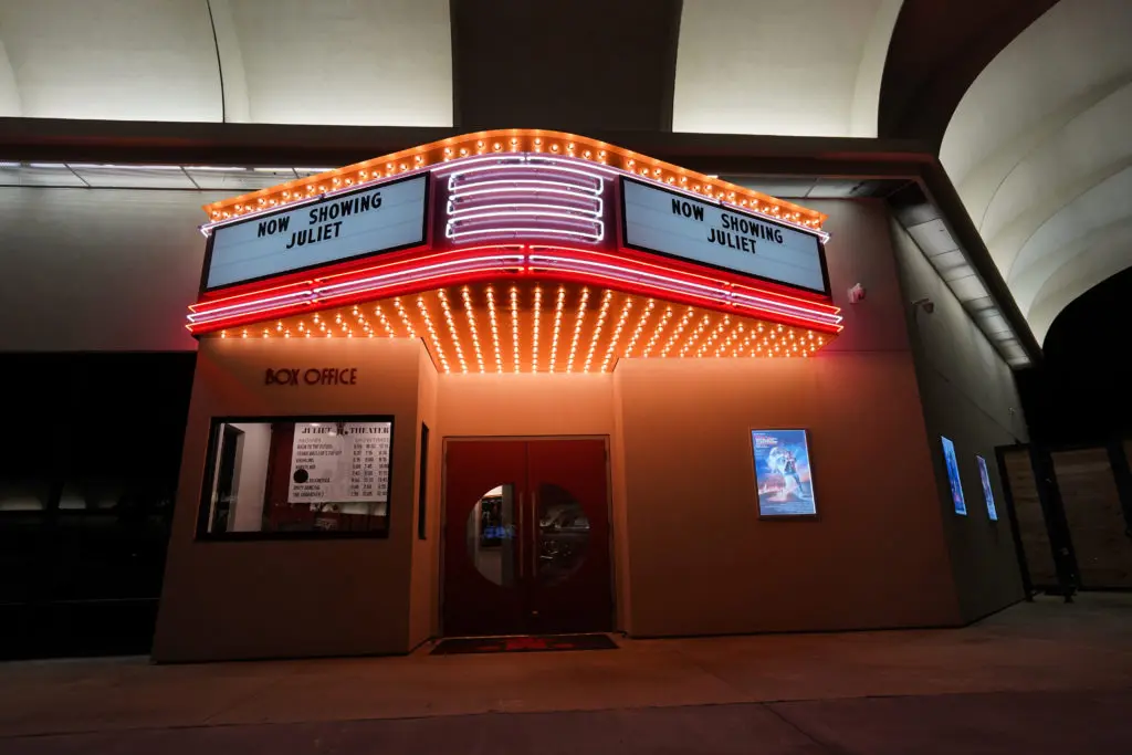 The faux movie theater entrance, including the box office, to Juliet belies the chic restaurant inside.