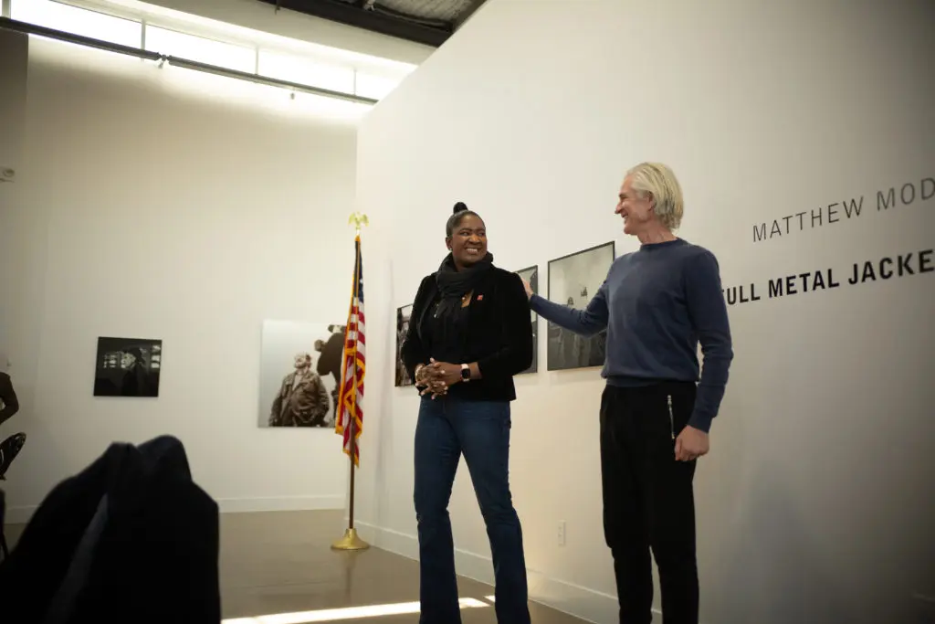 Houston's military veteran liaison, Lashondra Jones, speaks with Matthew Modine at the veteran's lunch hosted by Alta Arts on January 23.