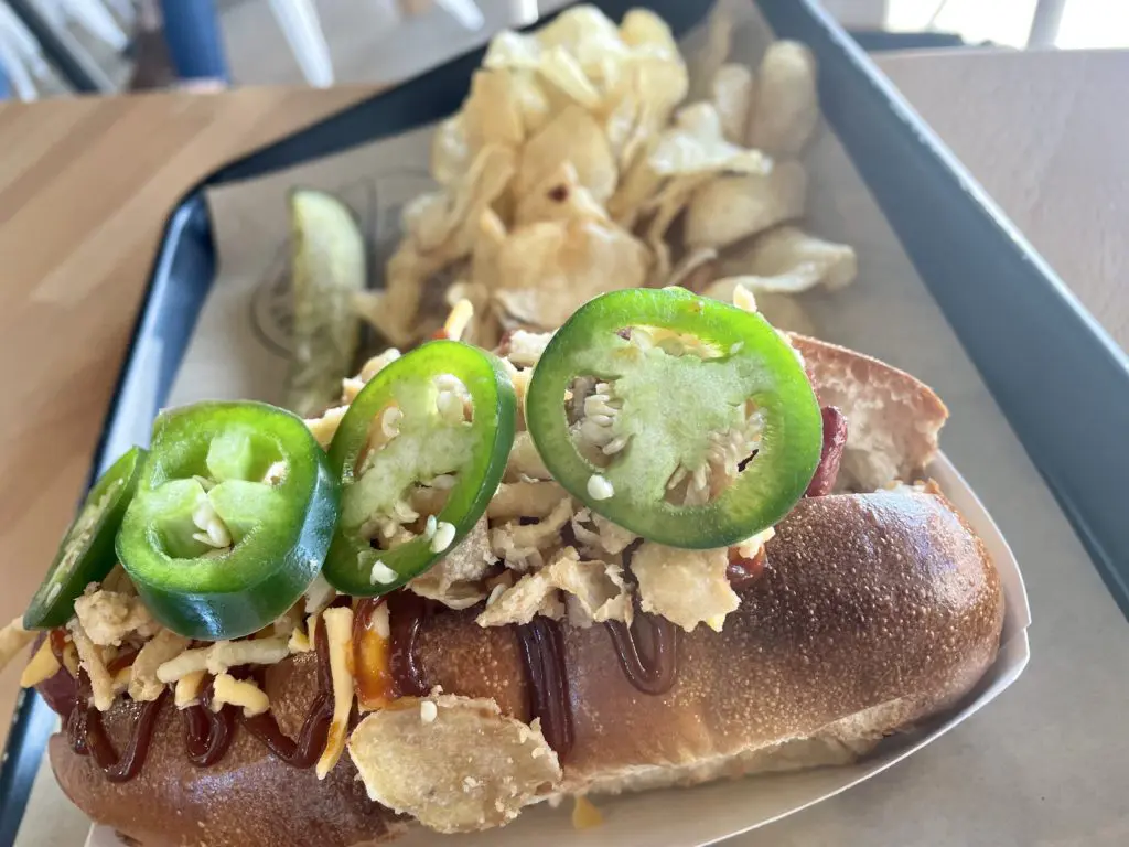 The Big Tex Dog topped with fried onions, BBQ sauce and jalapeno slices. Photo by Courtney Dabney.