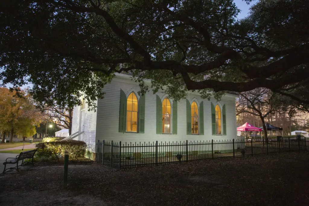 The historic St. John Church, 1891, illuminating the grounds of The Heritage Society at Sam Houston Park with love and light. (Photo by Jenny Antill Clifton)