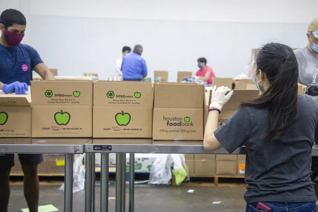 During the COVID-19 pandemic volunteers worked to load and unload boxes of supplies to those in need. (Photo: The Houston Food Bank)  (Photo by The Houston Food Bank)