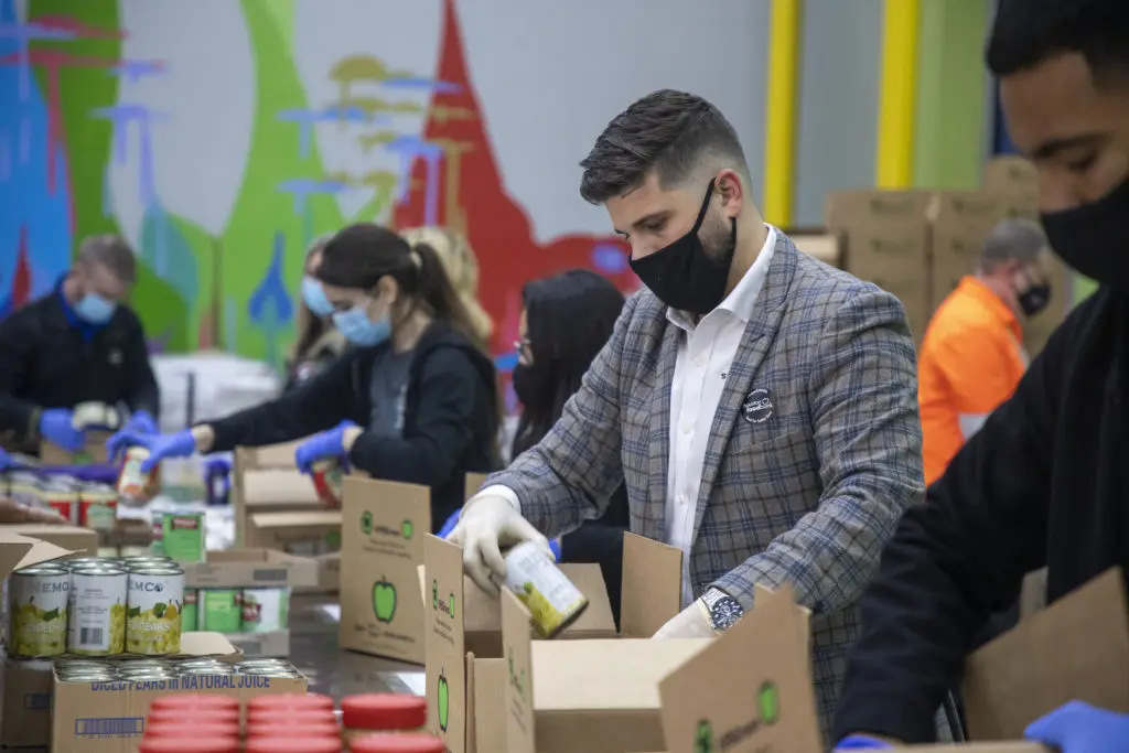 During the holiday season, volunteers pack boxes of food items and essentials for those in need. (Photo: The Houston Food Bank)  (Photo by The Houston Food Bank)
