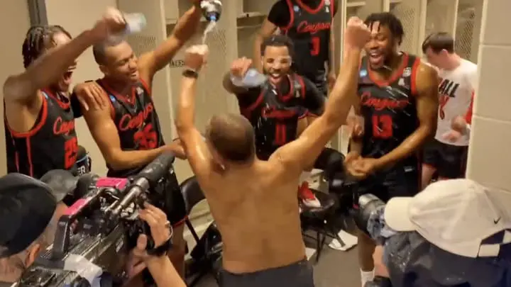 Houston coach Kelvin Sampson ripped off his shirt to celebrate a Sweet 16 punching win over Illinois. (Credit: KHOU photo)