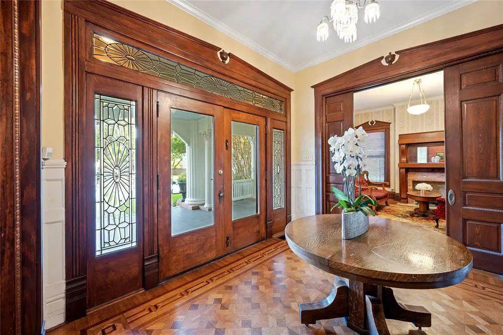 Inside, you'll find the original leaded glass framing the entryway