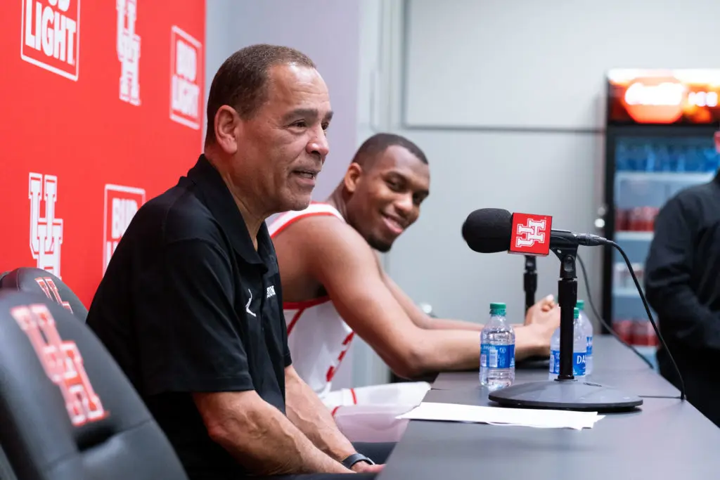 University of Houston coach Kelvin Sampson and Fabian White Jr. share a laugh at a press conference. (Photo by F. Carter Smith)