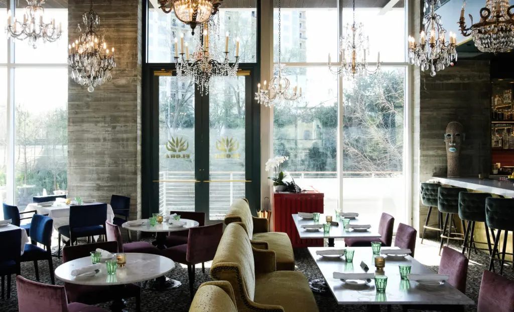A view of the entrance and intimate seating by the bar of Flora. (Photo by Jack Thompson)
