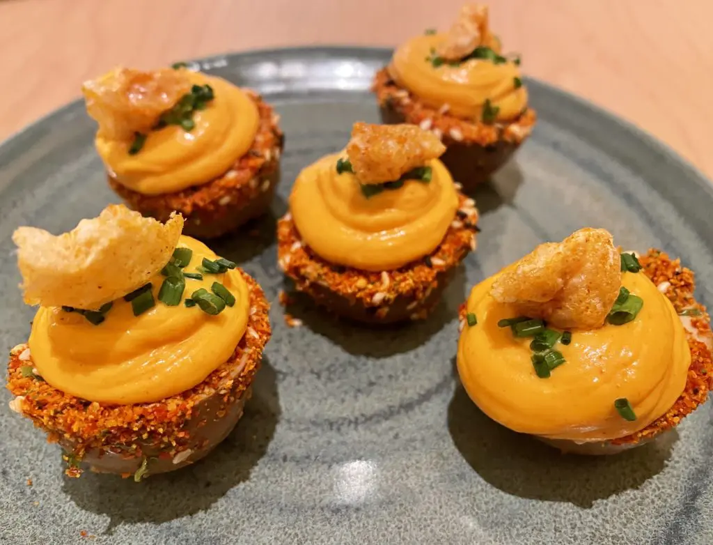 Chicharron and chive topped devilled eggs. Photo by Courtney Dabney.