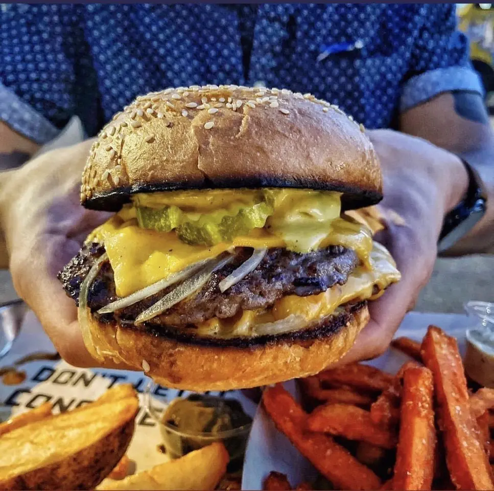 The mighty Double Double Burger at the new Johnny Good Burger at the POST Downtown. (Photo courtesy of FAM) Hospitality.