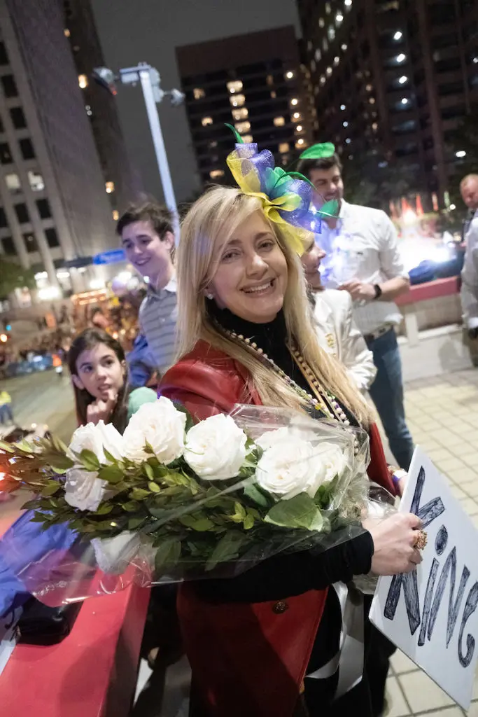 Nancy Valobra receives a bouquet of roses from Krewe of Hermes King Franco Valobra during the parade  watch party at Blake Hotel (Photo by Daniel Ortiz)