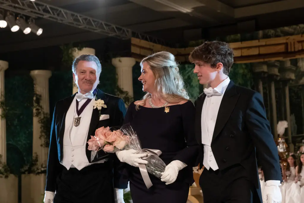 Robert Lupo, Nancy Valobra, Maximo Valobra as she is escorted to her seat during the Krewe of Hermes presentation ball in New Orleans (Photo by Daniel Ortiz)