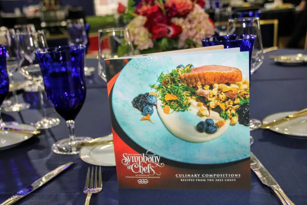 The Symphony of Chefs 2022 cookbook, filled with recipes from participating Dallas chefs. 