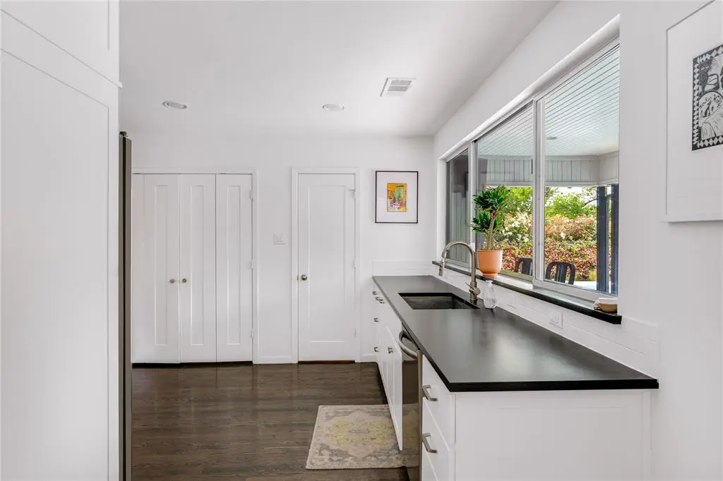 Glimpse the charming backyard while you cook. 