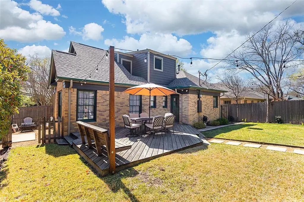 Fresh landscaping sets the string-lit backyard scene. 