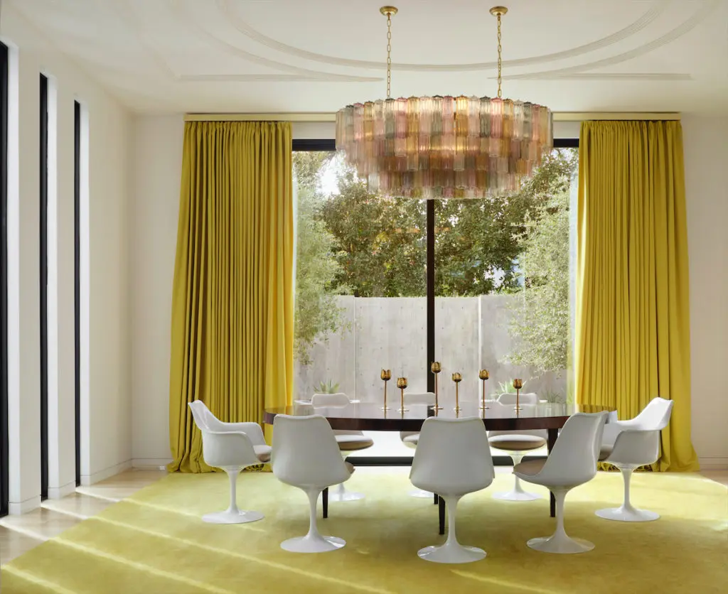 The dining room's Brazilian rosewood table custom made by Keith Fritz through George Cameron Nash. Eero Saarinen chairs from Knoll. Custom rug from The Rug Company. Murano 1970s chandelier from France. Julie Hayes and architect Weldon Turner collaborated on the plaster ceiling design. (Photo by Lisa Petrole)