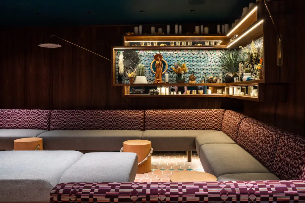 A corner banquette at Apatito, the speakeasy at La Mina.