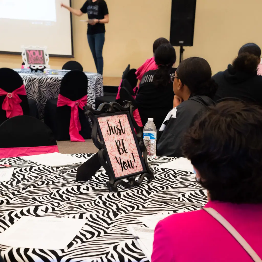 A financial seminar led by a member of the Junior League of the Woodlands teaches teens to budget, save, set goals and develop a plan to reach them. (Photo by Sara Blair Design Photography)