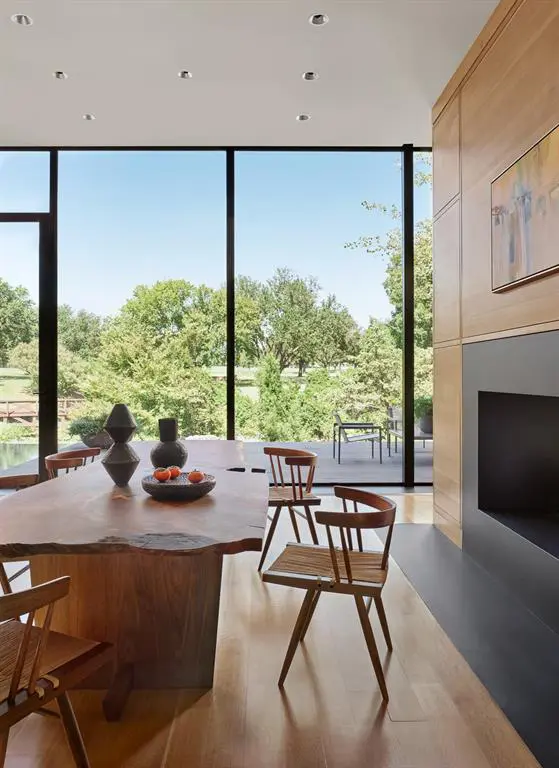 A dual-sided fireplace connects two living areas. 