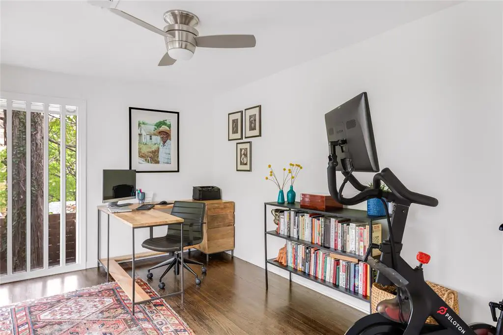 A spare room fashioned as a sunny office. 