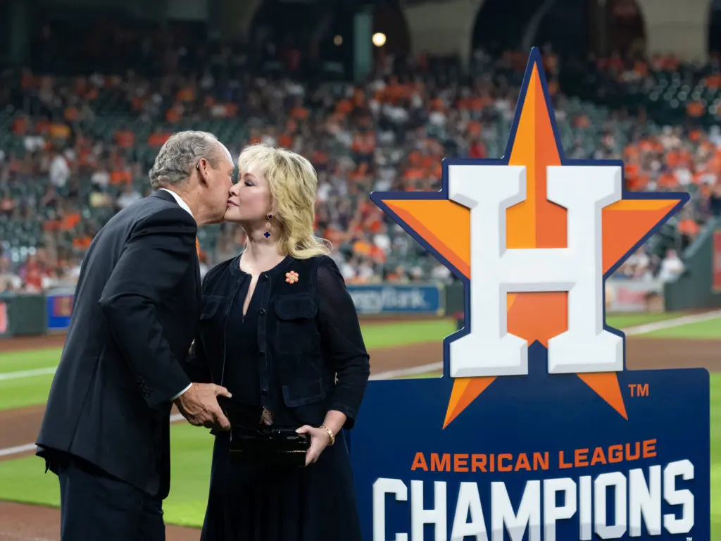 Houston Astros owner Jim Crane and his wife Whitney Crane shared a moment during the American League Championship celebration. (Photo by F. Carter Smith)