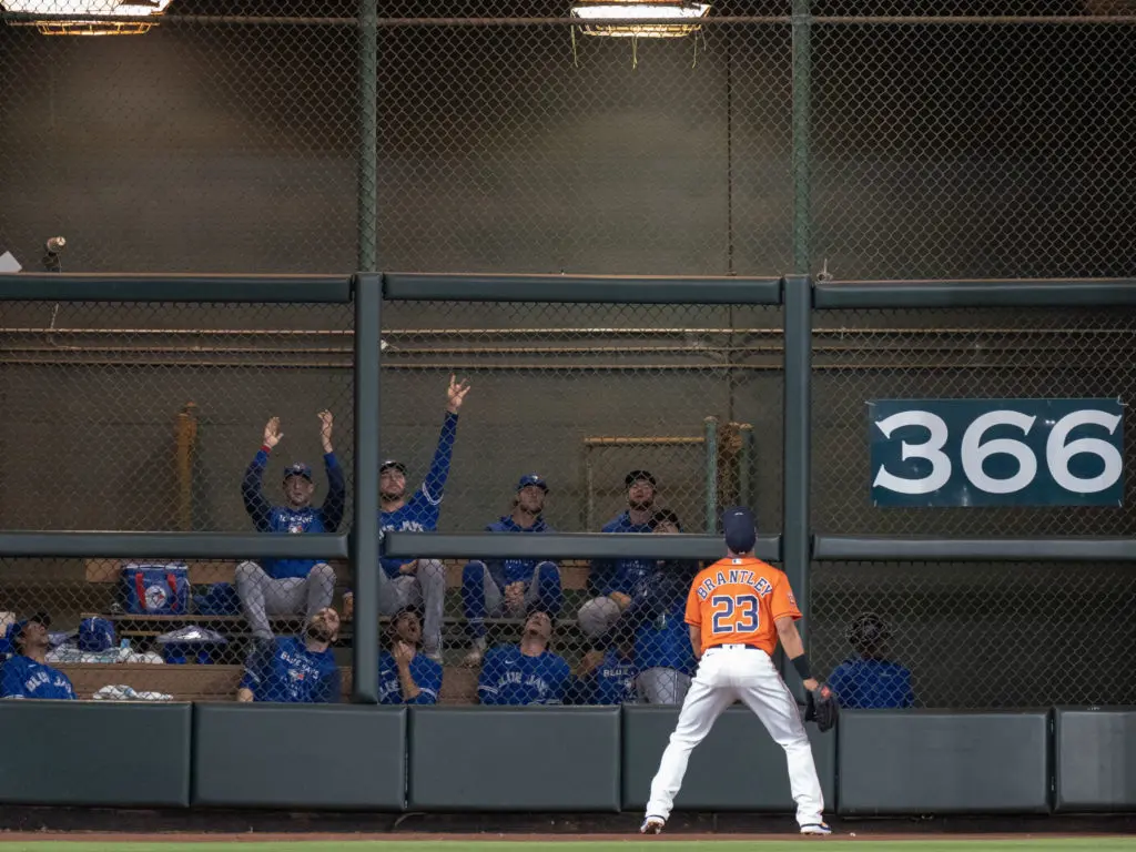 Astros outfielder Michael Brantley could only watch this one go as the Blue Jays' bullpen celebrated hard. (Photo by F. Carter Smith)