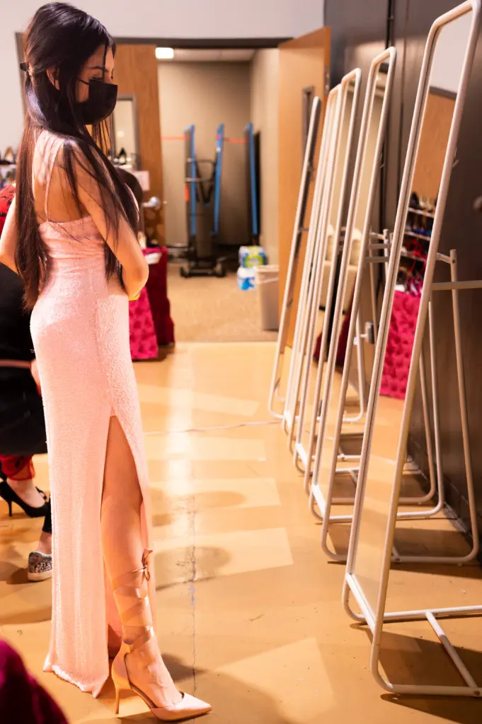 This teenager chose a pair of pink heels with ribbon straps to match her prom gown. (Photo by Sara Blair Design Photography)