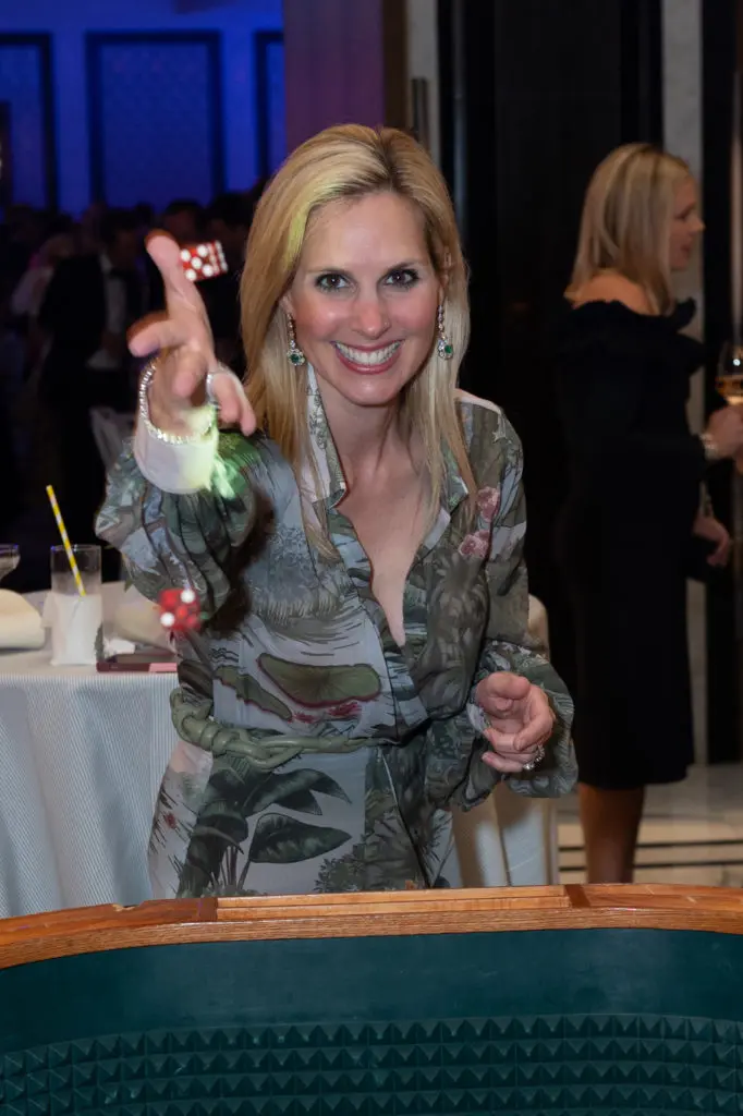 Blayne Bonham rolls the dice at The Children's Fund 50th anniversary gala (Photo by Wilson Parish)