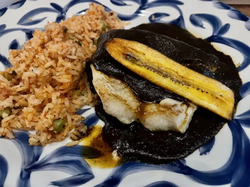 The Chilean Sea Bass en Mole Negro is a must. Photo by Courtney Dabney.