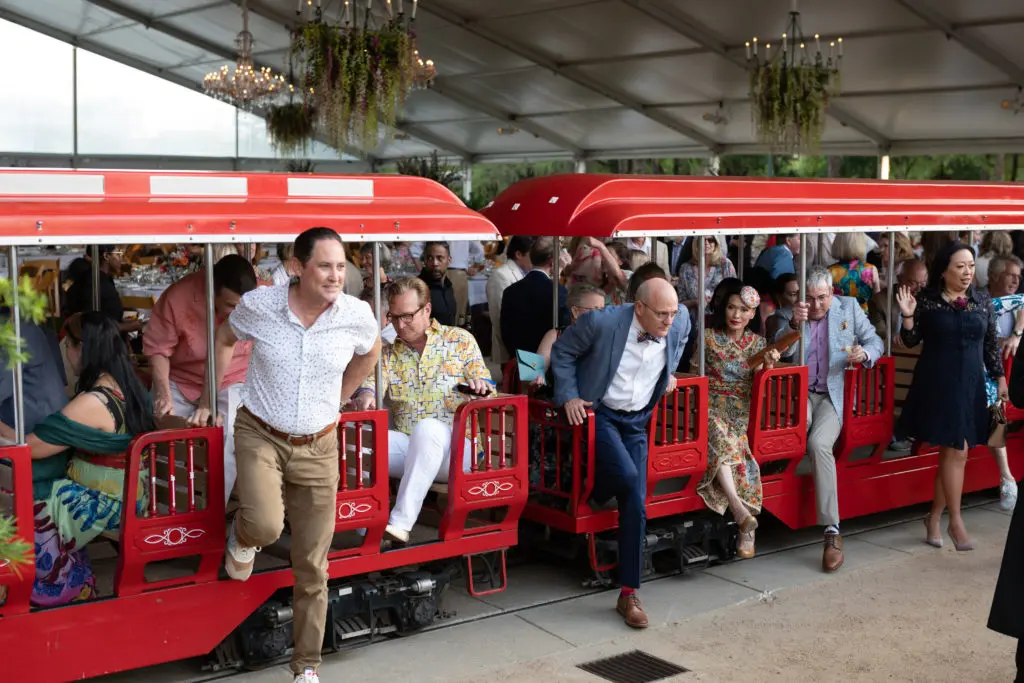 The Hermann Park Railroad delivers guests to the Molly Smith Plaza for cocktails before dinner at the tented 'Evening in the Park' fundraiser.  (Photo by Daniel Ortiz)