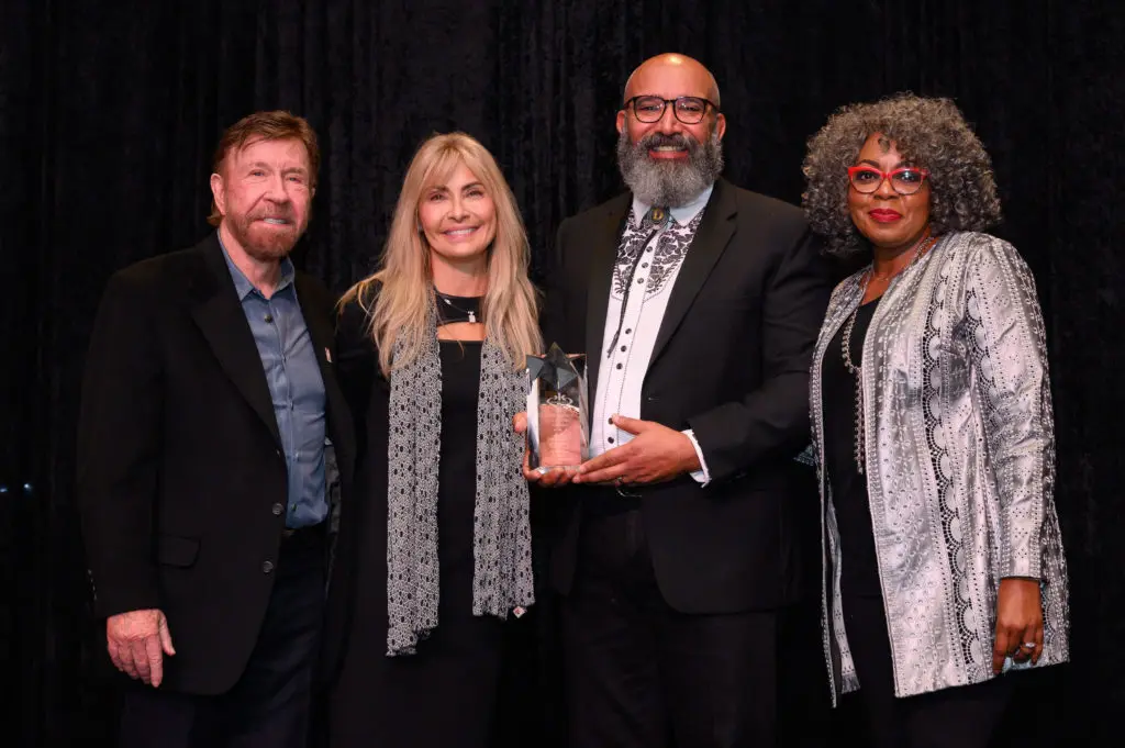 Chuck & Gena Norris with Kickstart Kids Founder's Vision Award recipient Dr. Charles Dupre and wife Seeju Dupre